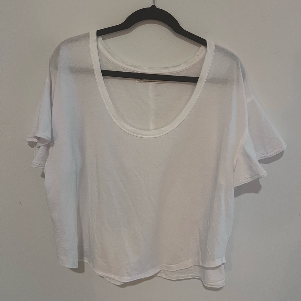 Free People White flowy tee shirt size M.